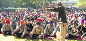 Activists of employees’ unions hold dharna at Mini Secretariat in Ludhiana on Tuesday.
