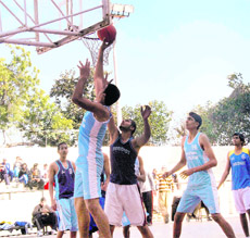 Players in action in a match between Ludhiana and Faridkot during the Punjab State Senior Basketball Championship, being held at Guru Nanak Stadium in Ludhiana.