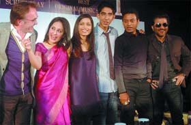 JAI HO! (Left to right) Director Danny Boyle with the cast of film Slumdog Millionaire  Loveleen Tandon, Frieda Pinto, Dev Patel, Irfan Khan and Anil Kapoor  during a press conference in New Delhi