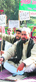 Members of the Muslim Uthaan and Madrasa Shiksha Samiti stage a dharna at Gandhi Park in Dehradun on Wednesday.