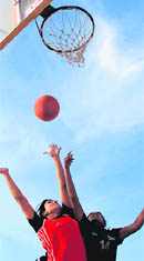 A basketball match in progress between Amritsar and Hoshiarpur in the 23rd Mata Sahib Kaur Sports Festival being held at Jarkhar village on Wednesday.