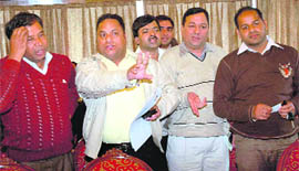 Bidders argue with officials conducting the auction at Hotel Shivalikview on Thursday.