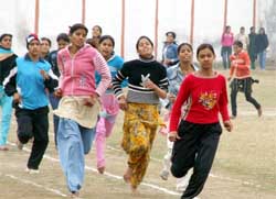 College girls participate in an athletic meet at Dronacharya College in Gurgaon