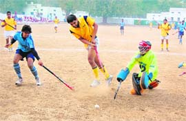 A player scores a goal in the Swami Shraddhanand Hockey Tournament in Haridwar on Thursday.