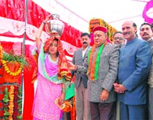 Chief Minister Prem Kumar Dhumal during the inauguration of water harvesting scheme in Pihri village, about 70 km from Dharamsala, 