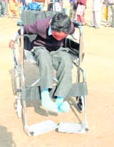 A differently abled child participates in a wheelchair race in Fatehabad