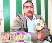 Krishan Lal Jhattipur, a lyricist, with his collection of albums.