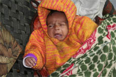 The month-old baby, who was allegedly sold by his parents, lies on a cot at Sadar police station in Jalandhar on Thursday.