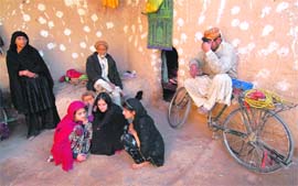 Relatives of arrested Afghan nationals sit in a mud house after a raid by intelligence agents on the outskirts of Peshawar on Thursday. Intelligence agents interrogated a senior Saudi Al-Qaida suspect who was captured in a joint Pakistani-CIA raid and allegedly plotted the 2005 attacks that killed 52 people in London. The operative, named by Pakistani security officials as Zabi-ul-Taifi, was arrested with six other Afghan and Pakistani suspects when security forces stormed a militant den on January 21 on the outskirts of Peshawar.
