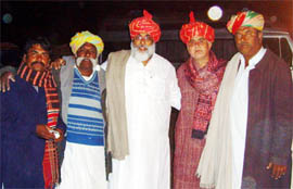 Shivinder Sandhu (centre) is seen with members of the Mangniyar singing community during  his visit to Jaisalmer. 