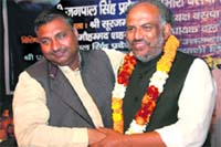 BSP leader Shahzad welcomes Subhash Sharma after he joined the party fold in Dehradun on Friday.
