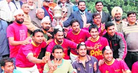 PNB hockey team with the winners trophy in Haridwar on Saturday.