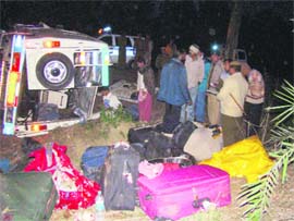 Police personnel examine the scene of a road accident near Shyamgarh in the Karnal area on Saturday. 