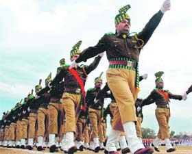 Police personnel take part in the dress rehearsal for the Republic Day celebrations in Jammu