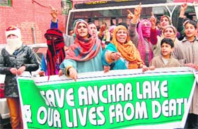People protest against the dumping of garbage at Achen Saidpora in Srinagar