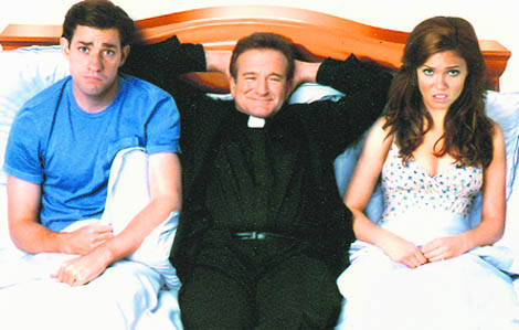  License to Wed on HBO stars Robin Williams (C) as the loony Reverend Frank
