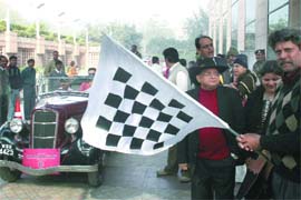 Former Indian cricket captain Kapil Dev flags off the Vintage Car Rally at Vasant Kunj in New Delhi on Sunday.