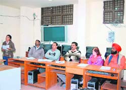 Journalism and mass communication student Shreyashi presents her poem on Subhash Chandra Bose, while Ravinder Dhillon, Amit Sangwan, Virender Singh Chauhan, Padmani Jain and Sewa Singh Bajwa seated (from left to right) on the dais at a function organised in CDLU recently.