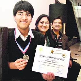 Divyansh Aggarwal with his parents at his house in Ludhiana