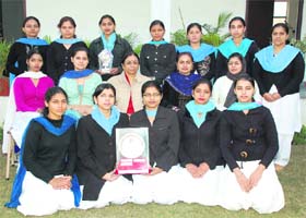 Students of Doraha College of Education pose with the Smt Saroj Bansal Memorial Running Trophy