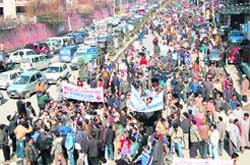 Government employees of various departments hold a protest in Srinagar
