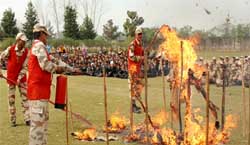 The ITBP personnel demonstrating fire-fighting techniques to the students of Silver Oak School in Bathinda