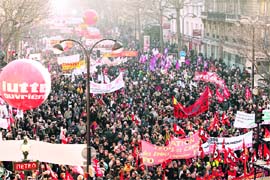 Public and private sector workers demonstrate with banners and giant balloons during a protest march in Paris on Thursday. Hundreds of thousands of French workers staged a nationwide strike to try to force President Nicolas Sarkozy and business leaders to do more to protect jobs and wages during the economic crisis.