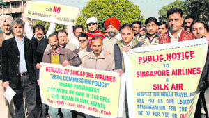 Travel agents protest against foreign airlines at Sector 17 in Chandigarh, on Friday.