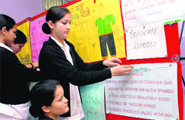 Nursing students participate in a poster-making competition at the Civil Surgeon office in Mohali on Friday.