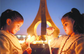 Children take part in a candlelight vigil on the Martyrs’ Day in Chandigarh on Friday.