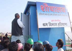 Haryana labour minister A.C. Chaudhary inaugurates a mobile toilet at Sector-44 in Gurgaon