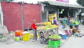 Shutters being put up on Rajpur Road in Dehradun. 