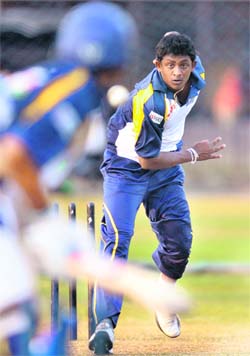 Sri Lankan cricketer Ajantha Mendis (R) delivers a ball during a training session at the R Peremadasa Stadium in Colombo on Friday.