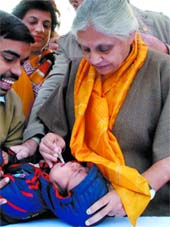 Chief Minister Sheila Dikshit administers polio drops to a child at her residence in New Delhi on Saturday.