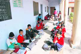 Students of Government Primary School, Dobhalwala, being taught in the corridors of the school.   Tribune photos: Vinod Pundir