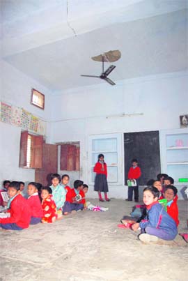 A class being conducted in a room with a damaged ceiling. Tribune photos: Vinod Pundir
