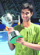 Yuki Bhambri holds up his trophy.