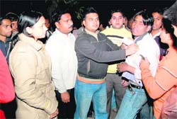 The autorickshaw driver, who misbehaved with a lady constable, being thrashed by locals in Haridwar on Saturday. 