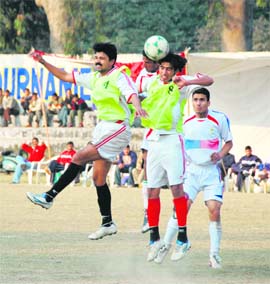 Players slug it out during the final of the 1st President Cup in Dehradun on Sunday. 