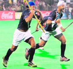 Indias Prabhjot Singh (L) and captain Sandeep Singh celebrate after scoring a goal against Holland in their match for the Punjab Gold Cup in Chandigarh on Sunday.  AFP