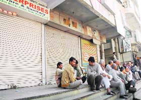 Traders close their establishments as Income Tax officials conduct a survey in the Bada Bazar area of Gurgaon