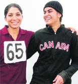 Balinder Kaur of College of Agriculture, who won the 100m race, is being congratulated by Jivanjot Kaur who was adjudged second