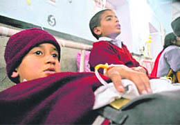 Students under treatment at Jammus SMGS Hospital on Thursday.