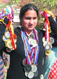 Sonali shows medals.