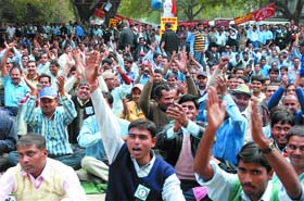 Activists of the All-India Loko Running Staff Association protest against the Sixth Pay Commission report at Jantar Mantar in New Delhi