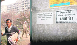 Writing on the wall: A poster stuck by members of the Pendu Chowkidar Union Nabha all over the Punjab main Secretariat takes a dig at the Punjab Chief Minister Parkash Singh Badal pointing out that Haryana has overtaken Punjab.