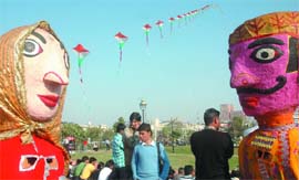People visit the Kite Festival at Central Park in New Delhi on Saturday.