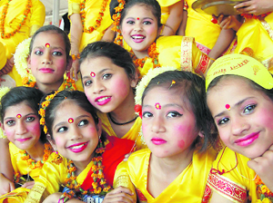 Children dressed up in yellow at ITBP Basant Mela in Dehradun.