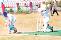 A player hits a shot during a match in the 57th District Cricket League at Survey Stadium in Dehradun on Saturday.