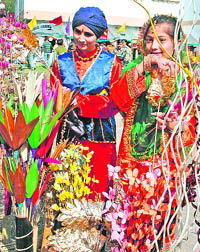 Schoolchildren dressed in colourful clothes during the Red Cross mela in Jammu on Saturday.